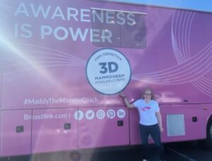 women pointing to 3d mammogram maddy mobile coach
