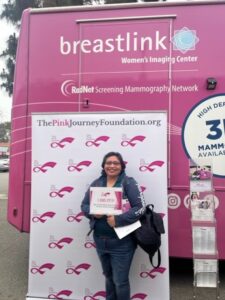 women happy with certificate after free mammogram