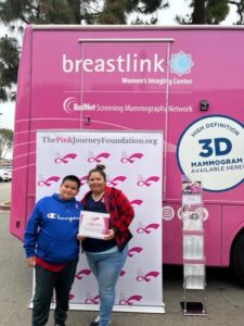 women and son smiling after free mammogram